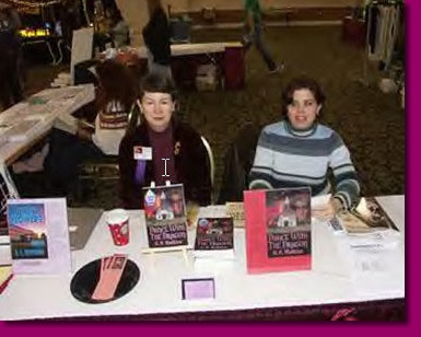 Staffing the Garden State Horror Writers vendor tables with Jennifer Persson (right) at the Philcon convention in Philadelphia, PA, Dec.11-12, 2004.
